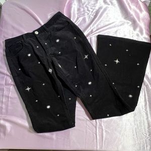 black flared corduroy jeans with cool white graphics